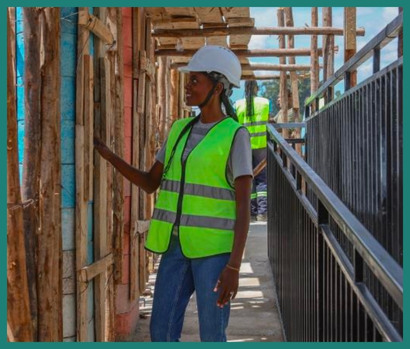 Woman inspects construction work.