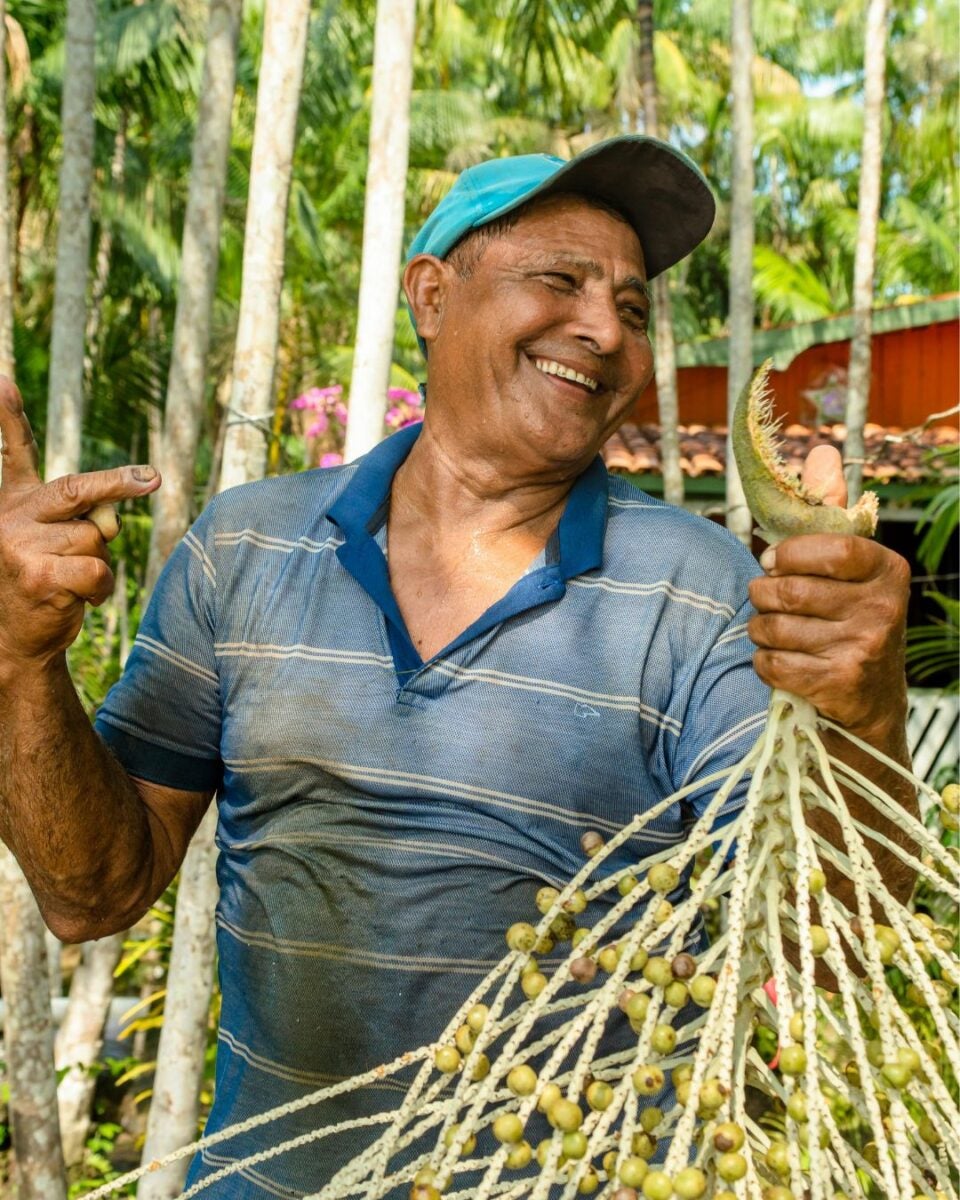 Smiling Farmer with Açaí Berries in Belém, Brazil