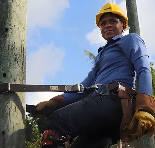 Winifred-Emmanuel, GSI hangs from a wooden electric pole in Jamaica. Photo Jamaica Obsrserver.