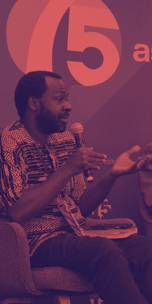 Joram Mwinamo, CEO of SNDBX | The Village Formula in a red filtered image.