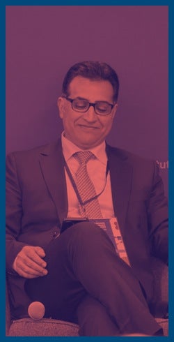 Quomar Salem sitting under a red filter.