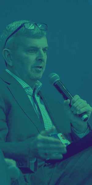 William Warshauer, President and CEO of TechnoServe under a green filter